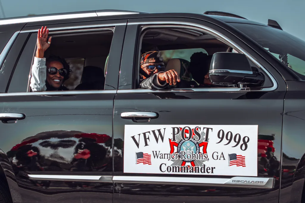 VFW Post 9998 Commander vehicle with people waving in parade